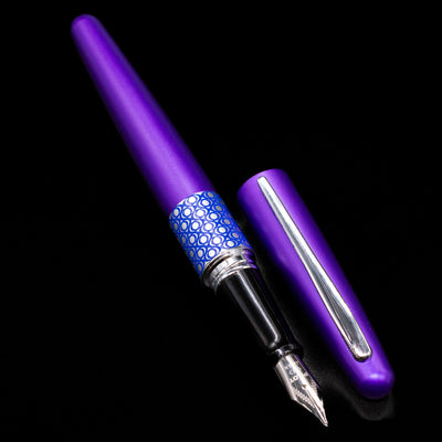 A full view of the Pilot Metropolitan MR Retro Pop Fountain Pen - Purple uncapped, with its cap laying next to the pen. 