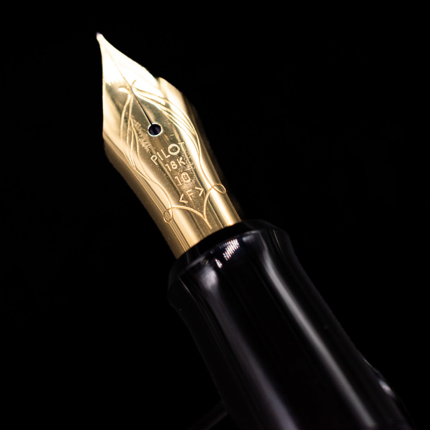 A macro shot of the nib with its intricate detailing and logo engraving for the Pilot Namiki Sokuikinen HouOu (Double Phoenix) Maki-e Fountain Pen by Kyusai Yoshida - Preowned.