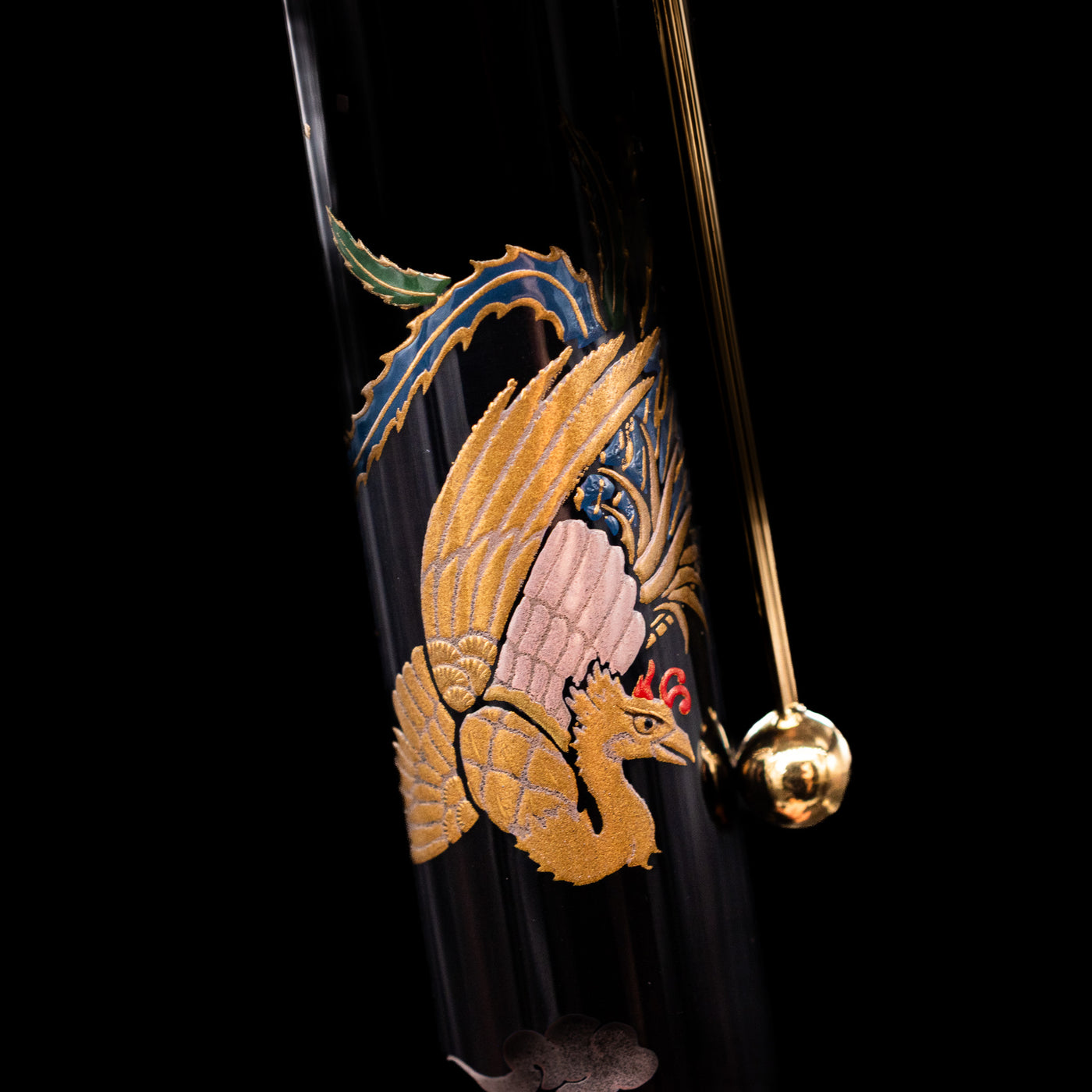 A close-up shot of the phoenix next to the clip on the Pilot Namiki Sokuikinen HouOu (Double Phoenix) Maki-e Fountain Pen by Kyusai Yoshida - Preowned.