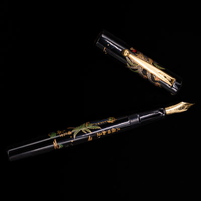 An overhead view of the Pilot Namiki Sokuikinen HouOu (Double Phoenix) Maki-e Fountain Pen by Kyusai Yoshida - Preowned uncapped.
