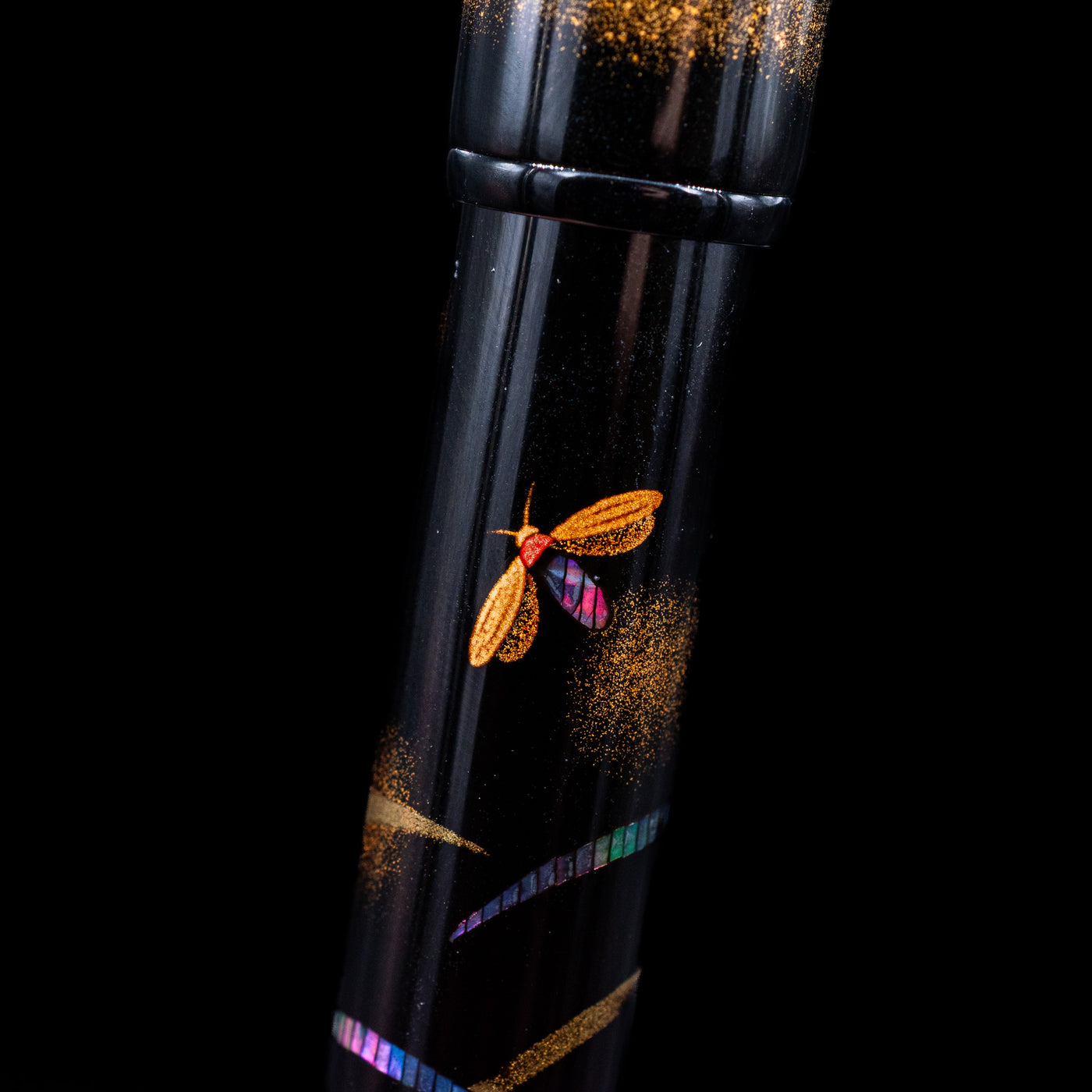 A macro shot showcasing the firefly detailing on the Pilot Namiki Yukari Maki-e Fountain Pen - Firefly.