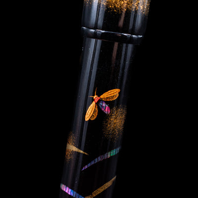 A macro shot showcasing the firefly detailing on the Pilot Namiki Yukari Maki-e Fountain Pen - Firefly.