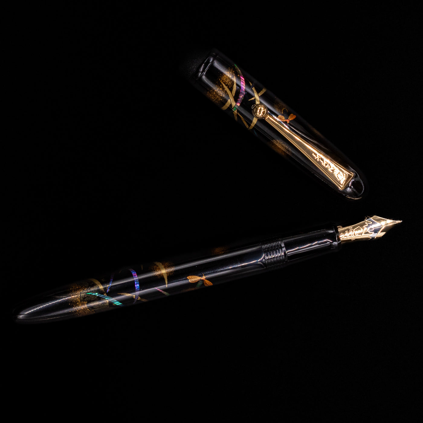 An overhead view of the Pilot Namiki Yukari Maki-e Fountain Pen - Firefly uncapped.