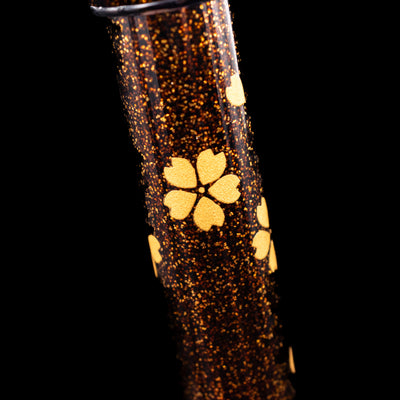 A macro shot of the flower details on the Pilot Namiki Yukari Maki-e Fountain Pen - Sakura Fubuki. 