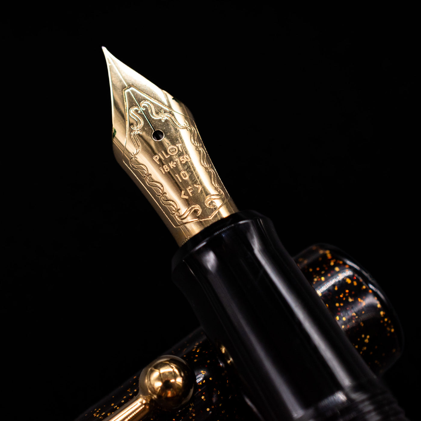 A macro shot of the nib with its intricate detailing and logo engraving for the Pilot Namiki Yukari Maki-e Fountain Pen - Sakura Fubuki.