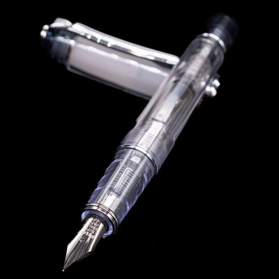 Pilot Prera Fountain Pen - Black laying across its own cap, crossed, with a focus on the nib.