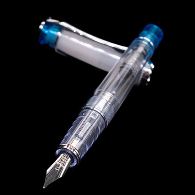 Pilot Prera Fountain Pen - Light Blue laying across its own cap, crossed, with a focus on the nib.