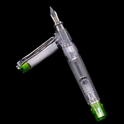 Pilot Prera Fountain Pen - Light Green laying on top of its cap in a crossed position showing full view of the entire uncapped pen.