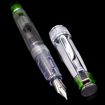 A full view of the Pilot Prera Fountain Pen - Light Green uncapped, with its cap laying next to the pen. 