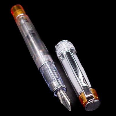  A full view of the Pilot Prera Fountain Pen - Orange uncapped, with its cap laying next to the pen. 