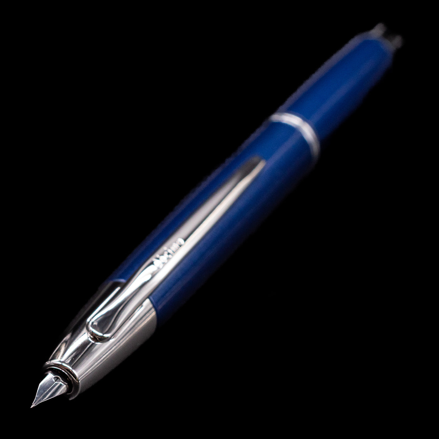 A full view of the Pilot Vanishing Point Decimo Fountain Pen - Navy Blue with a focus on the activated nib.