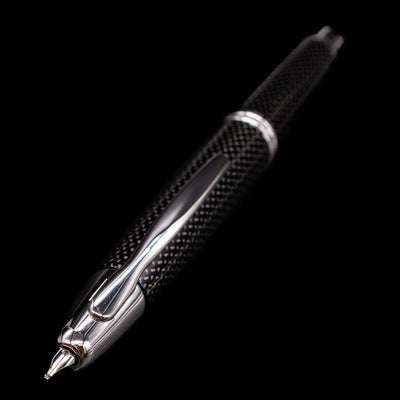 A full view of the Pilot Vanishing Point Fountain Pen - Black Carbonesque with a focus on the activated nib.