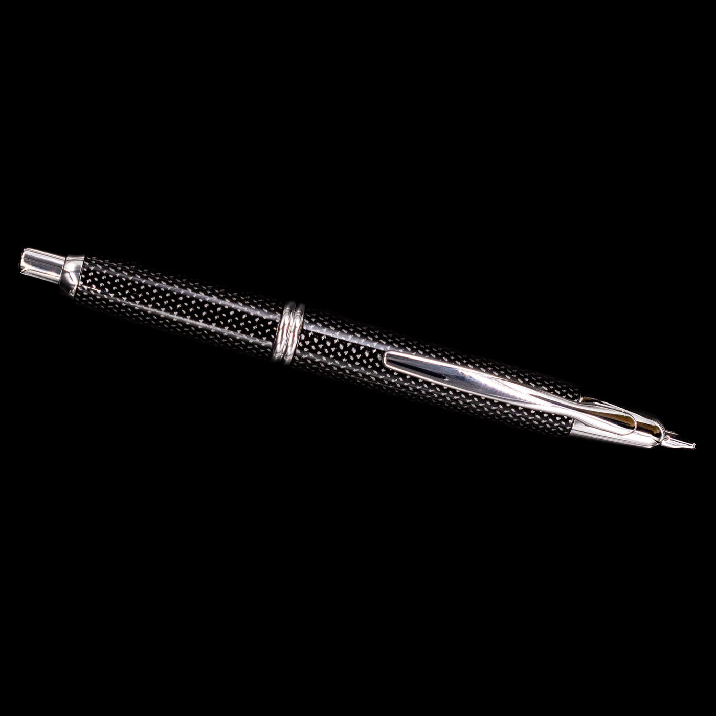 An overhead view of the Pilot Vanishing Point Fountain Pen - Black Carbonesque uncapped.