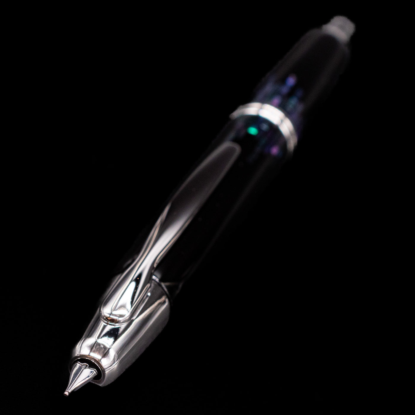 A full view of the Pilot Vanishing Point Fountain Pen - Raden Stripe at an angle, showcasing its nib.
