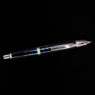 An overhead view of the Pilot Vanishing Point Fountain Pen - Raden Water Surface uncapped.