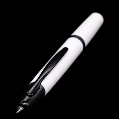 A full view of the Pilot Vanishing Point Fountain Pen - White & Black activated with a focus on the nib.
