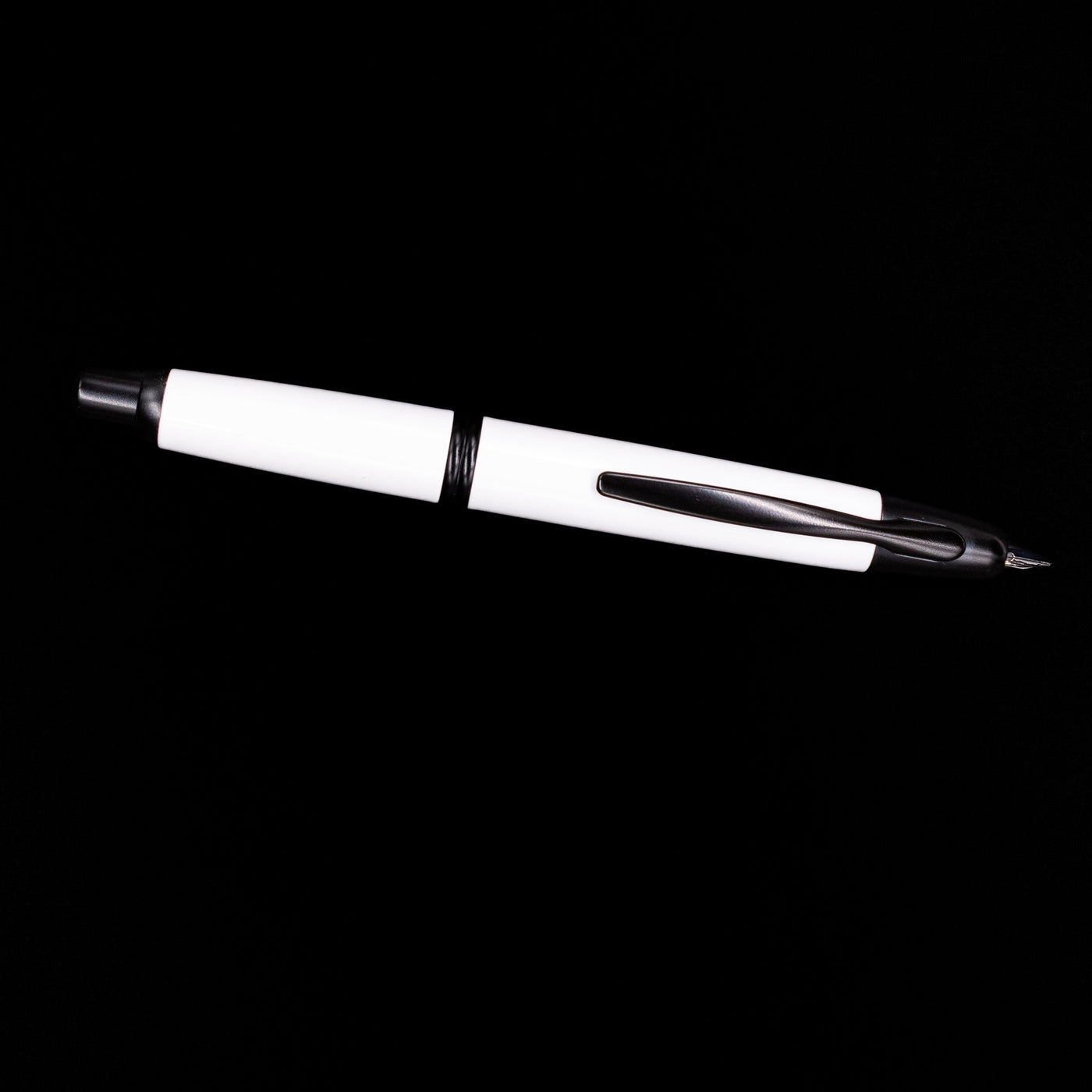 An overhead view of the Pilot Vanishing Point Fountain Pen - White & Black uncapped.