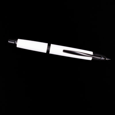 An overhead view of the Pilot Vanishing Point Fountain Pen - White & Black uncapped.