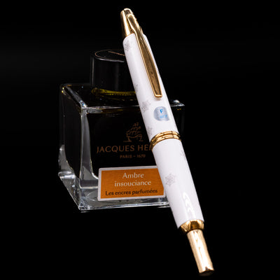 Pilot Vanishing Point Limited Edition Fountain Pen - Disney 100 Mickey Mouse leaning on an ink bottle. 