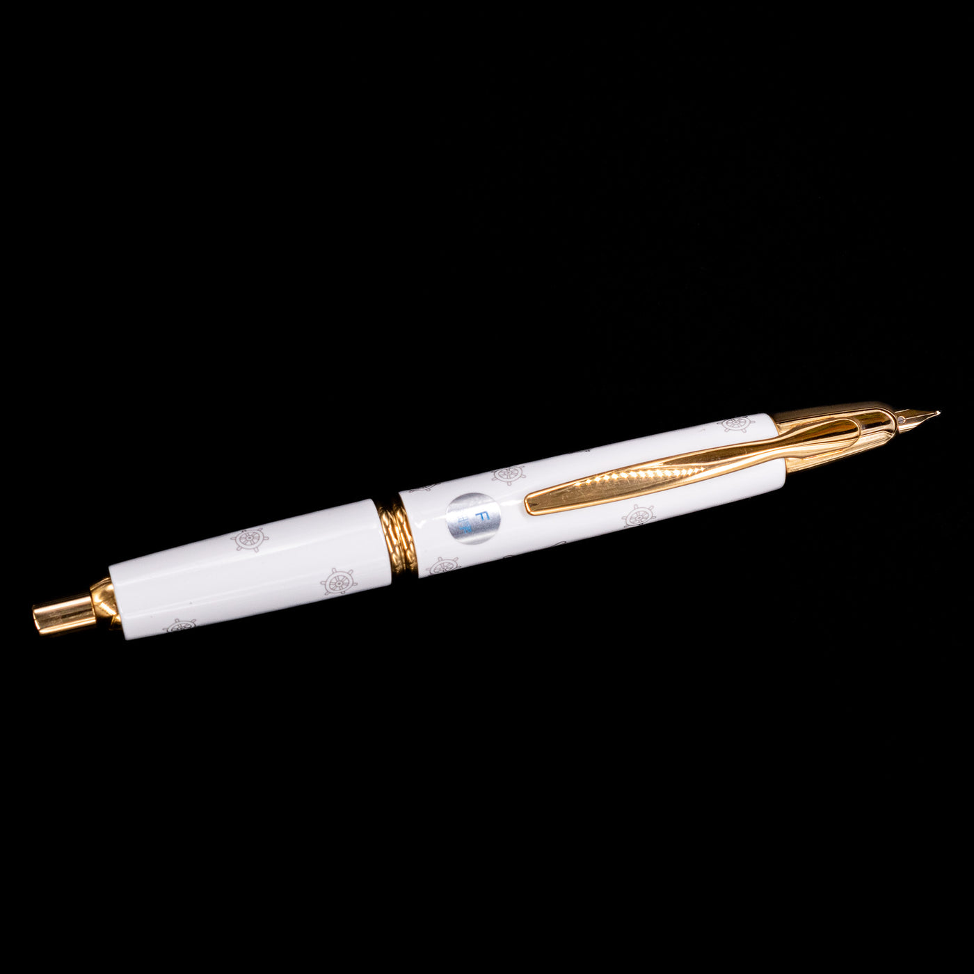 An overhead view of the Pilot Vanishing Point Limited Edition Fountain Pen - Disney 100 Mickey Mouse activated.