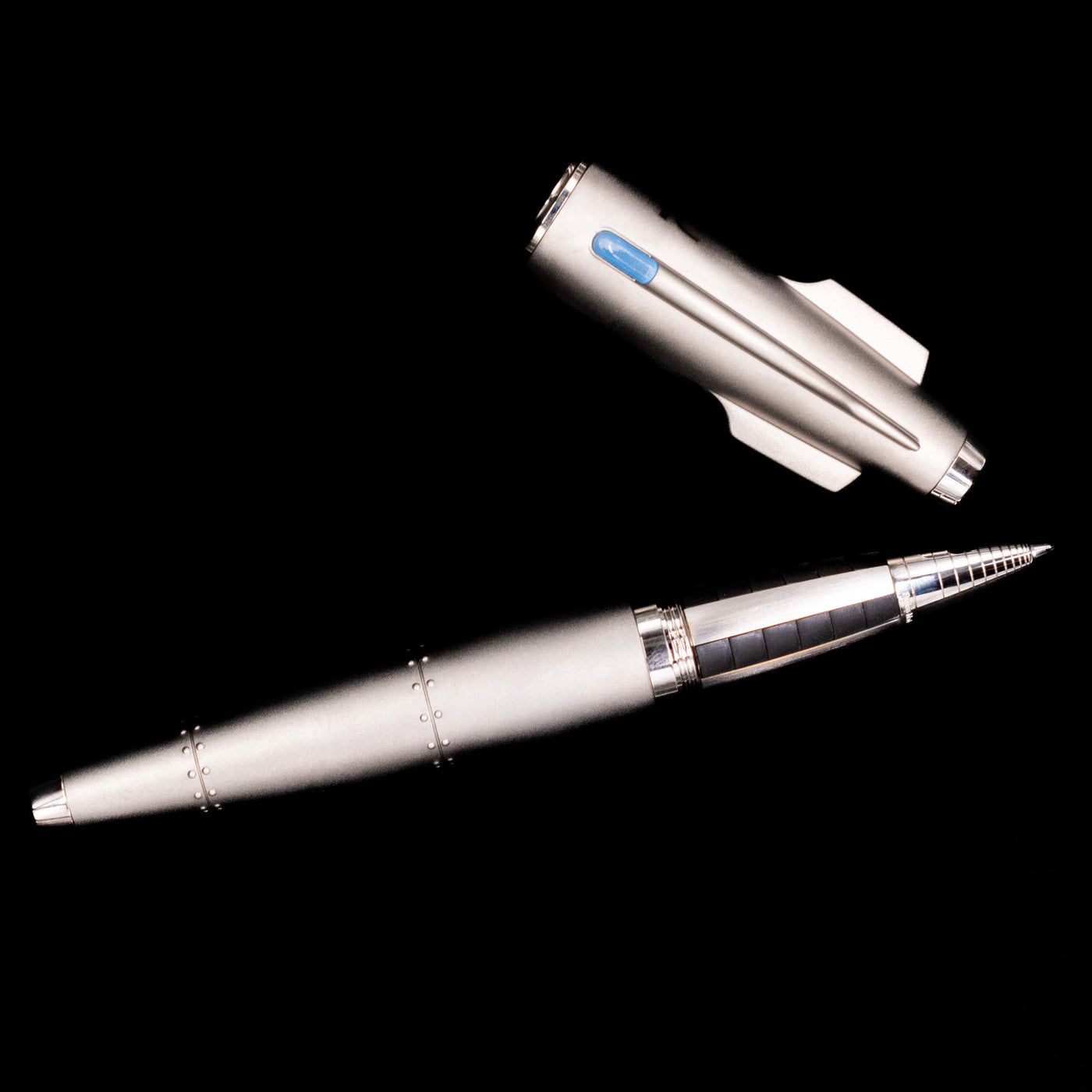 An overhead view of the Romain Jerome Moon Fighter Rollerball Pen - Heavy Metal uncapped.