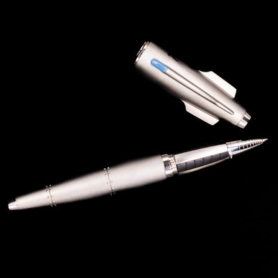 An overhead view of the Romain Jerome Moon Fighter Rollerball Pen - Heavy Metal uncapped.