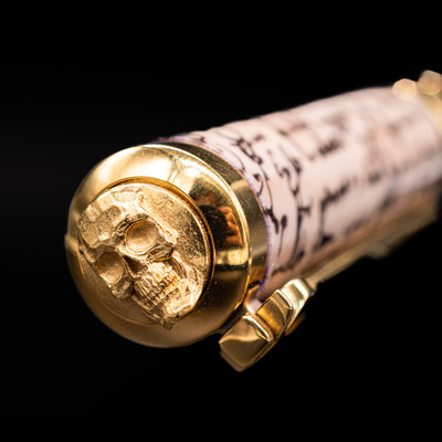 Zoomed-in view of the top of the cap with the skull finial on the ST Dupont William Shakespeare Rollerball Pen - Preowned.