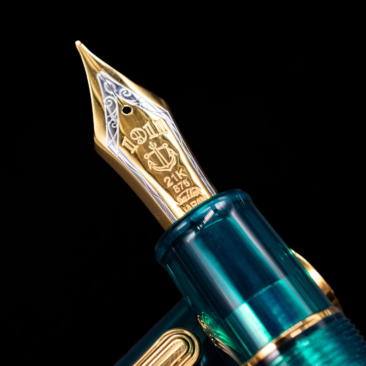 A macro shot of the nib with its intricate detailing and logo engraving for the Sailor Professional Gear King of Pens Teal Green Wancher Fountain Pen - Preowned.