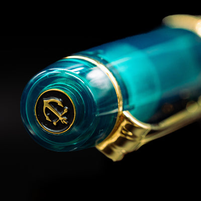 Zoomed-in view of the top of the cap with the finial on the Sailor Professional Gear King of Pens Teal Green Wancher Fountain Pen - Preowned.