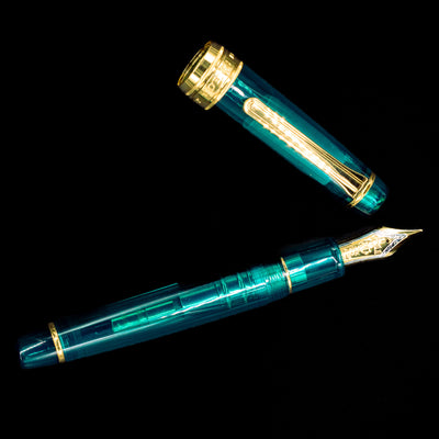 An overhead view of the Sailor Professional Gear King of Pens Teal Green Wancher Fountain Pen - Preowned uncapped.