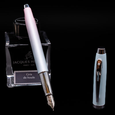 Sheaffer 100 Fountain Pen - Expressions leaning on an ink bottle uncapped showcasing the detailing on the nib.