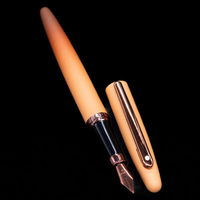 A full view of the Sheaffer VFM Fountain Pen - Coffee (Special Edition) uncapped, with its cap laying next to the pen. 