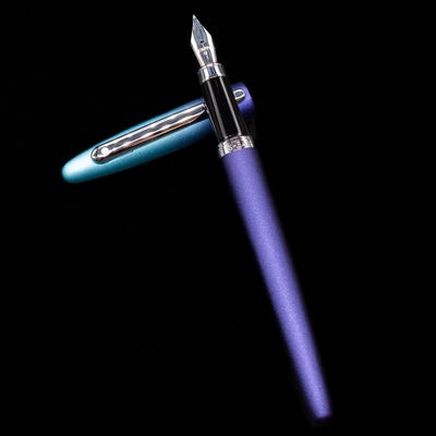 Sheaffer VFM Fountain Pen - Expressions laying on top of its cap in a crossed position showing full view of the entire uncapped pen.