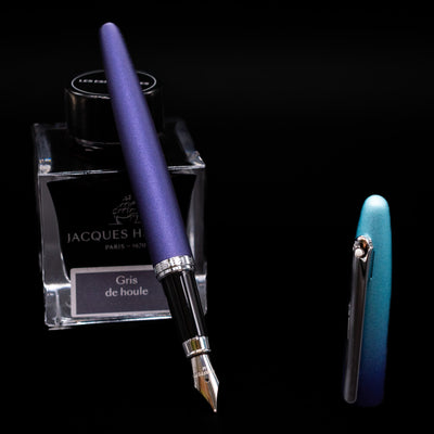 Sheaffer VFM Fountain Pen - Expressions leaning on an ink bottle uncapped showcasing the detailing on the nib.