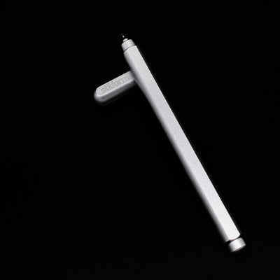 Stilform ARC Gel Pen – Comet Grey Aluminum laying on top of its cap in a crossed position showing full view of the entire uncapped pen.
