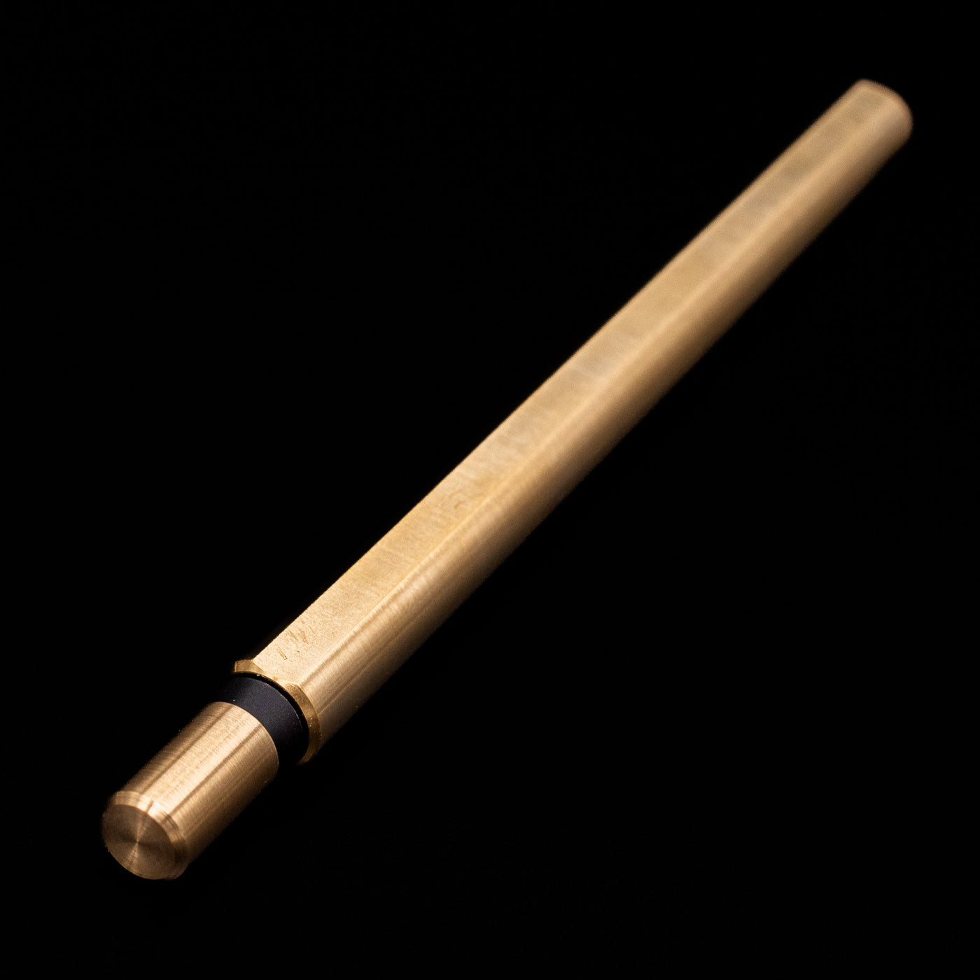 Full view of the Stilform FLOW Rollerball Pen – Brass Radial Brushed capped but activated.