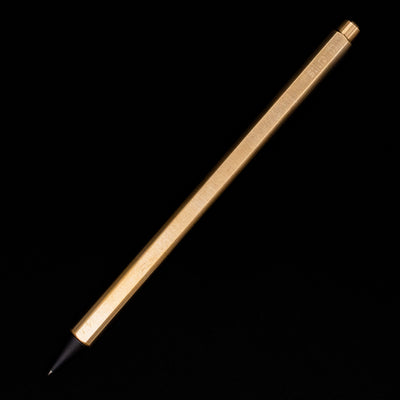 An overhead view of the Stilform FLOW Rollerball Pen – Brass Radial Brushed posted.