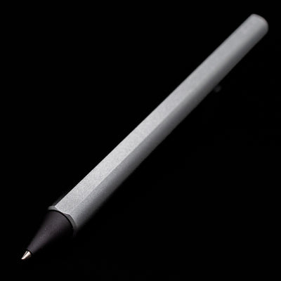 A full view of the Stilform FLOW Rollerball Pen – Comet Grey Aluminum uncapped at an angle showcasing the tip.