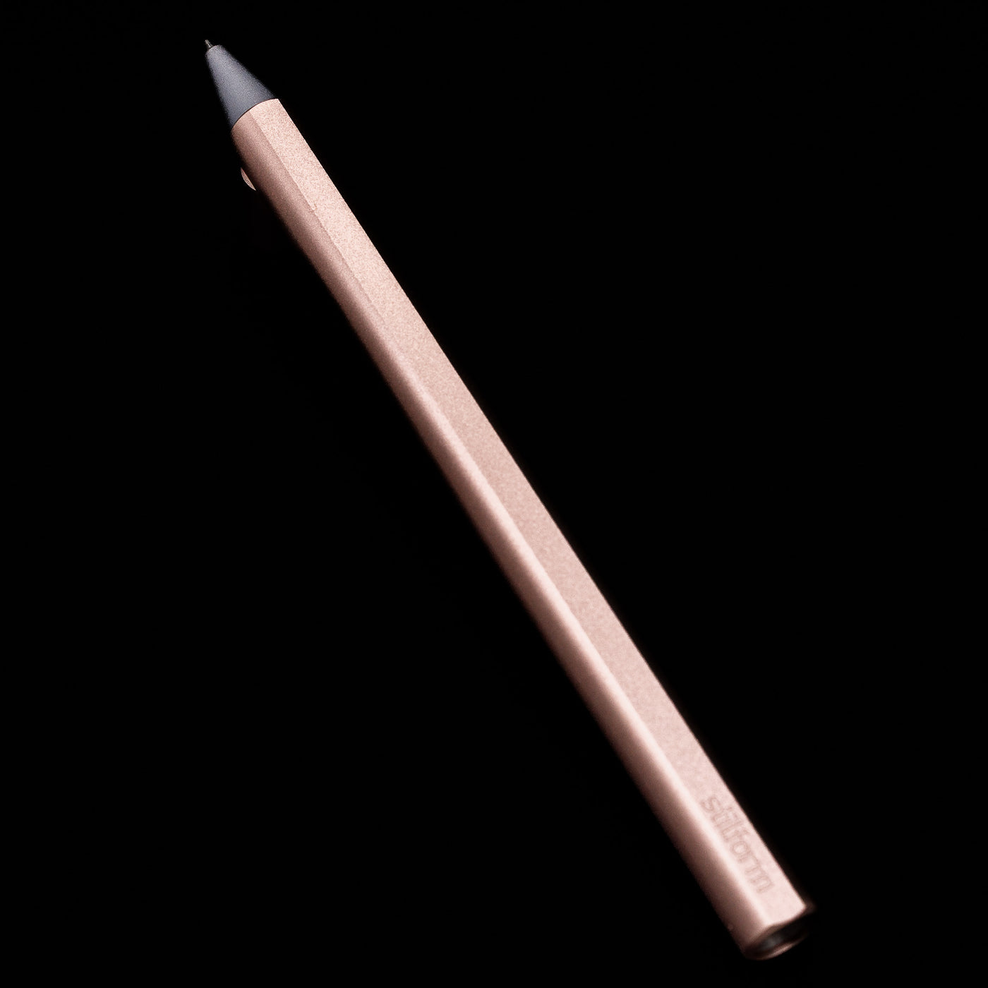 Full view of the Stilform FLOW Rollerball Pen – Rose Moon Aluminium at an angle propped up on its cap.