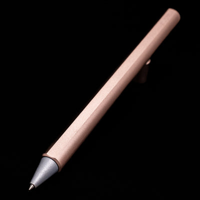 Full view of the Stilform FLOW Rollerball Pen – Rose Moon Aluminium at an angle with a focus on its tip.