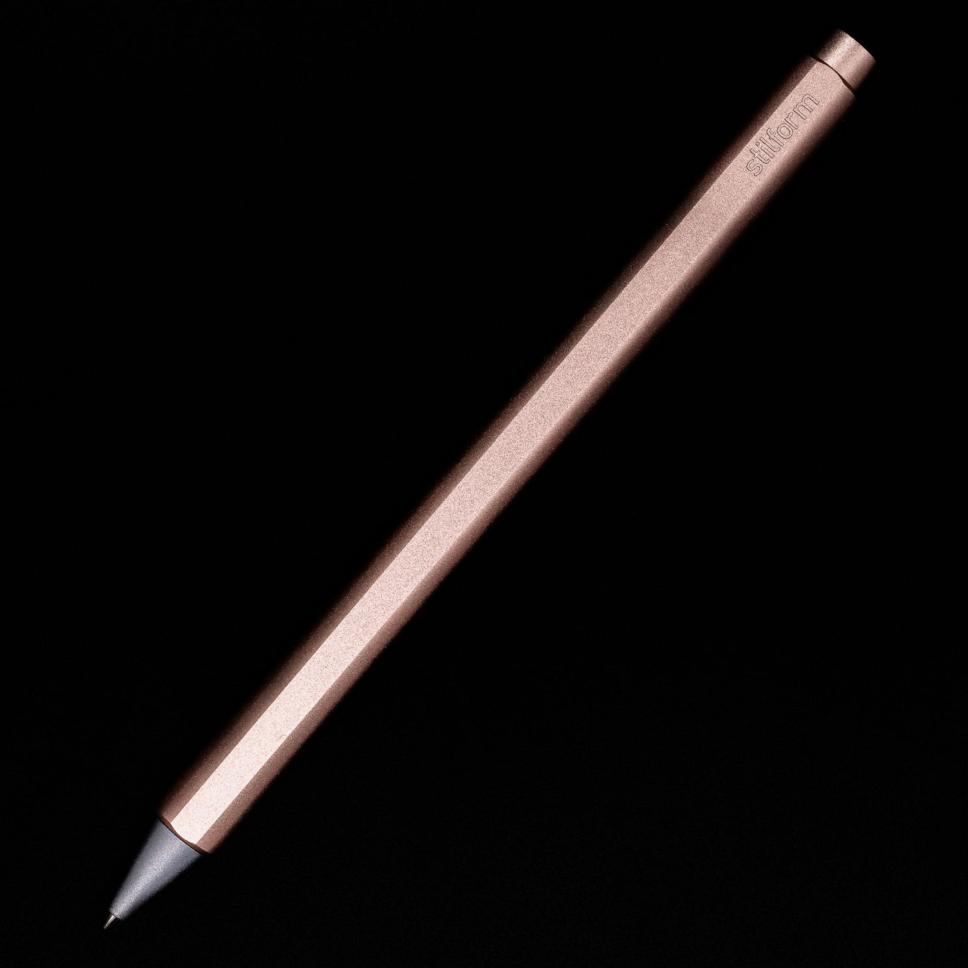 An overhead view of the Stilform FLOW Rollerball Pen – Rose Moon Aluminium posted.