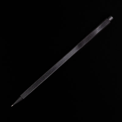 An overhead view of the Stilform FLOW Rollerball Pen – Warp Black Aluminum uncapped and posted.