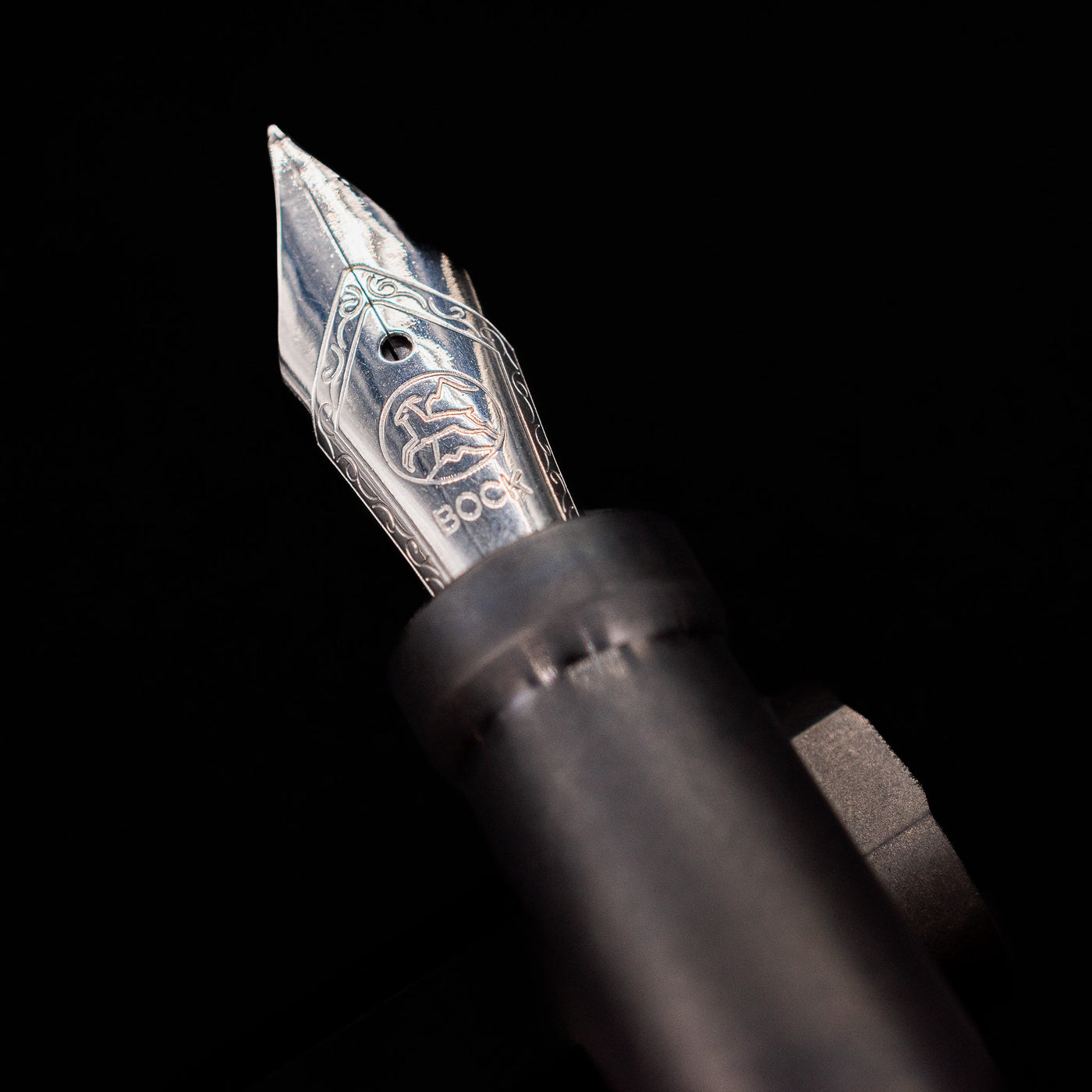 A macro shot of the nib with its intricate detailing and logo engraving for the Stilform INK Fountain Pen – Titanium DLC.