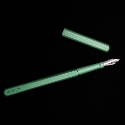 An overhead view of the Stilform INK Fountain Pen – Aurora Green Aluminum uncapped.