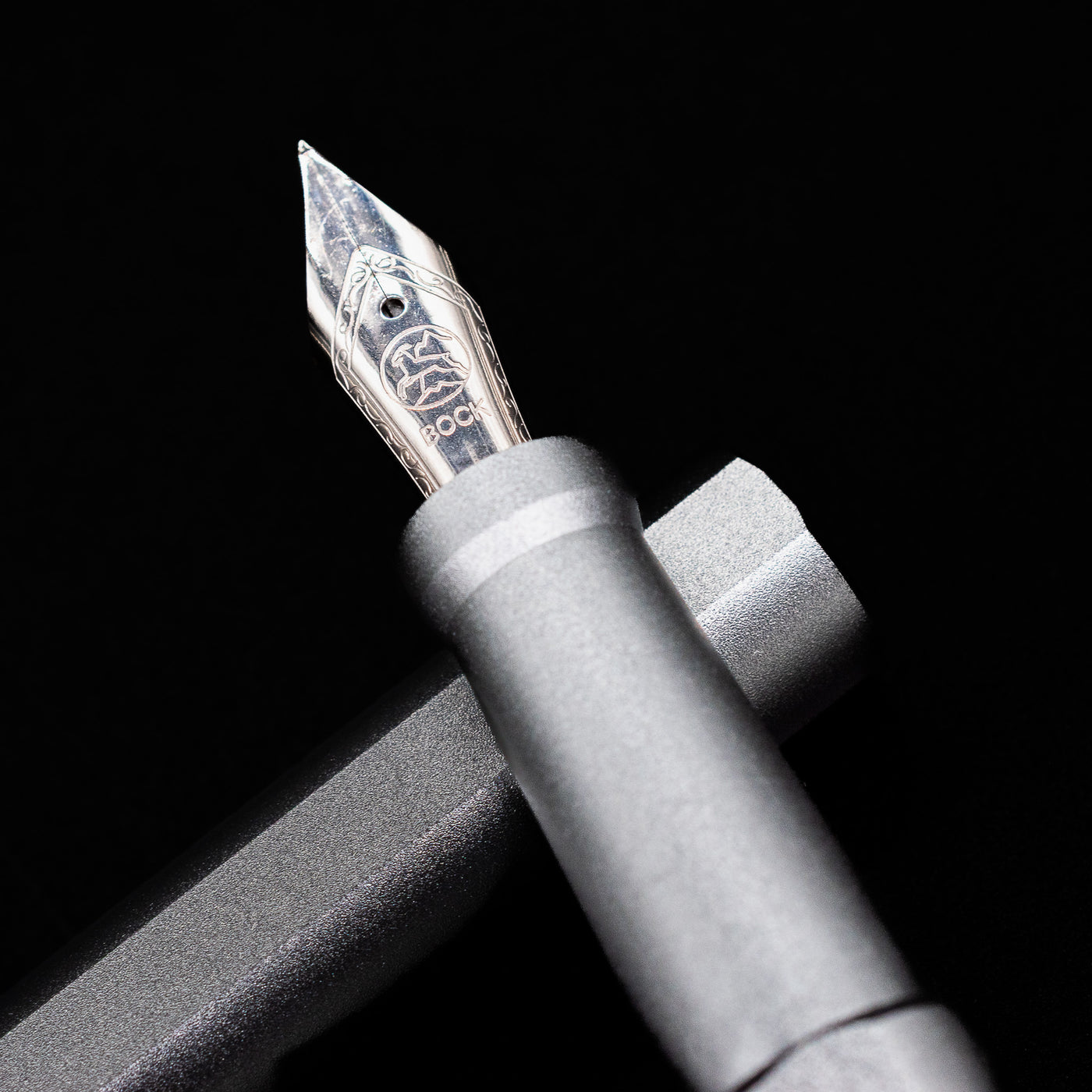 A macro shot of the nib with its intricate detailing and logo engraving for the Stilform INK Fountain Pen – Comet Grey Aluminum.