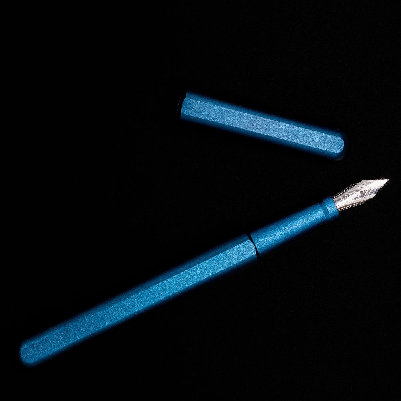 An overhea view of the Stilform INK Fountain Pen – Night Sky Aluminum uncapped.