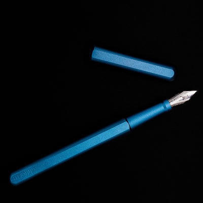 An overhea view of the Stilform INK Fountain Pen – Night Sky Aluminum uncapped.