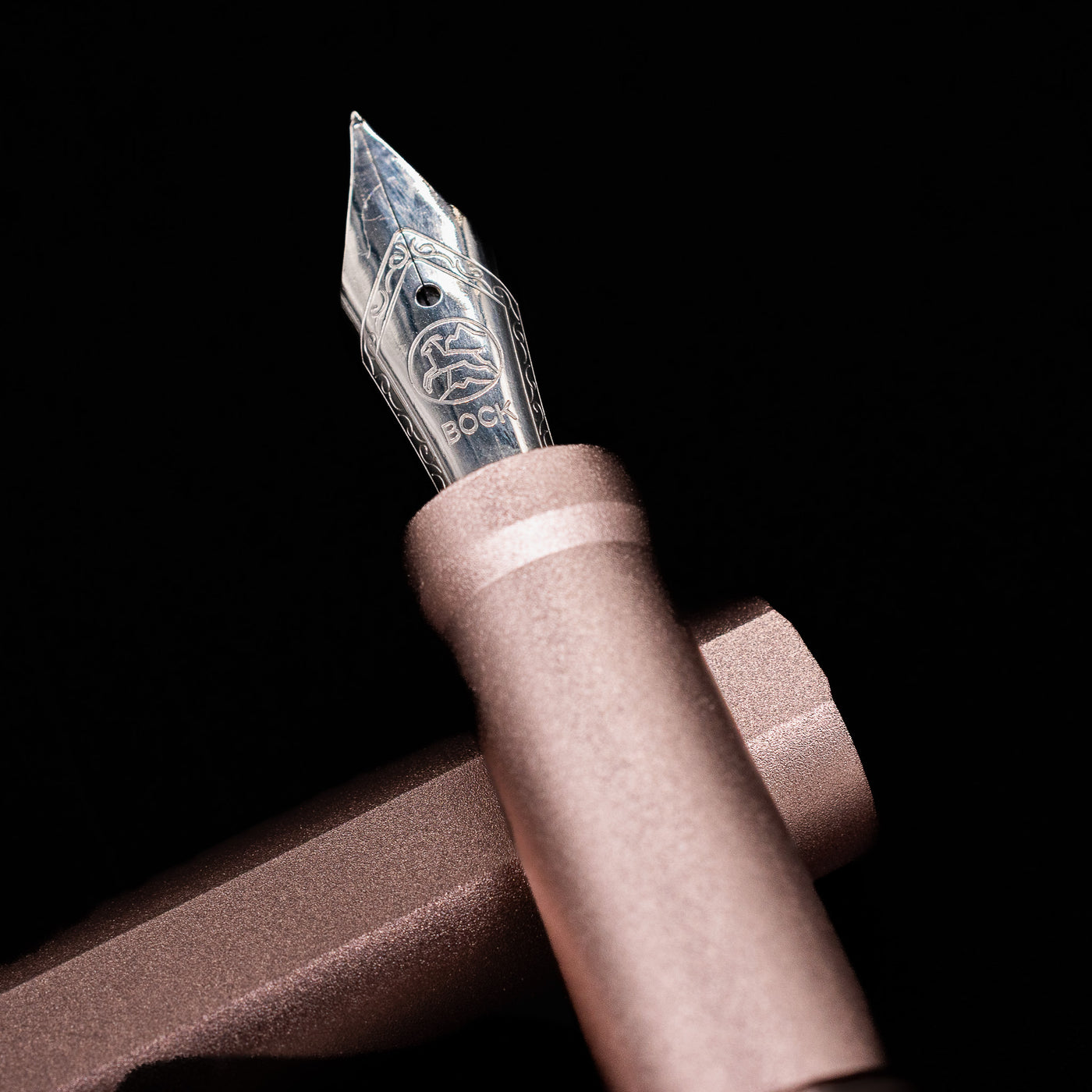 A macro shot of the nib with its intricate detailing and logo engraving for the Stilform INK Fountain Pen – Rose Moon Aluminum.