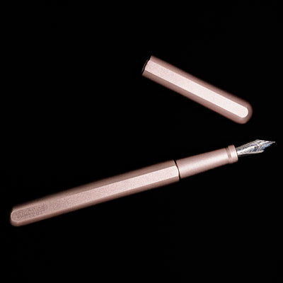 An overhead view of the Stilform INK Fountain Pen – Rose Moon Aluminum uncapped.