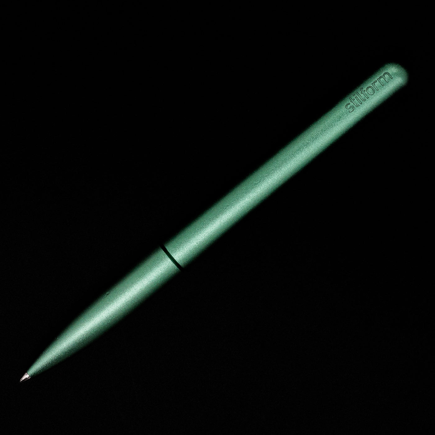 An overhead view of the Stilform PEN Ballpoint Pen – Aurora Green Aluminum activated.